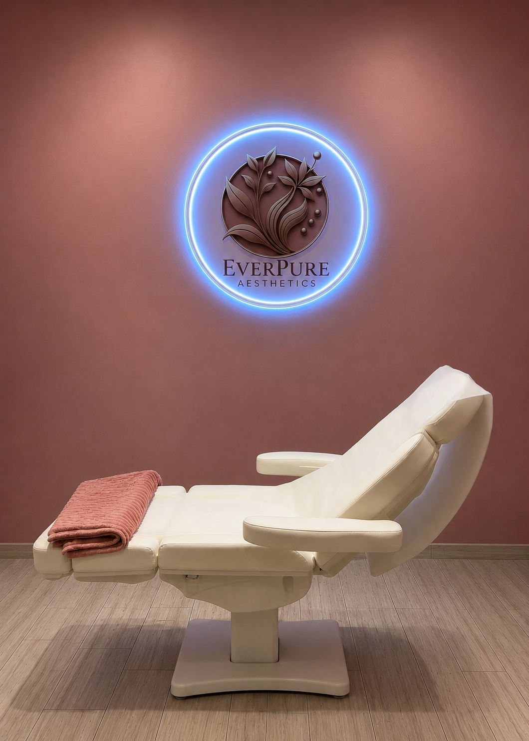 EverPure Aesthetics treatment room with branded wall logo